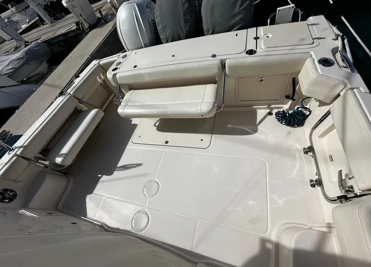  Yacht Photos Pics 2021 Grady-White Express 370 boat deck with seating and storage compartments.