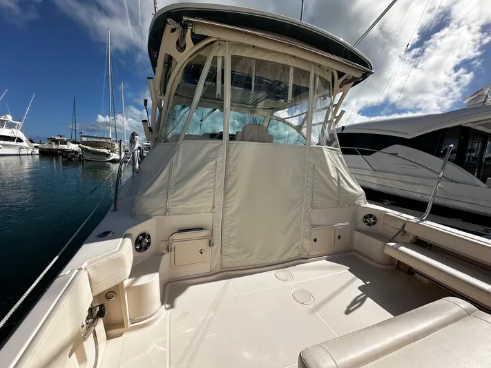  Yacht Photos Pics 2021 Grady-White Express 370 boat docked at marina under blue sky.