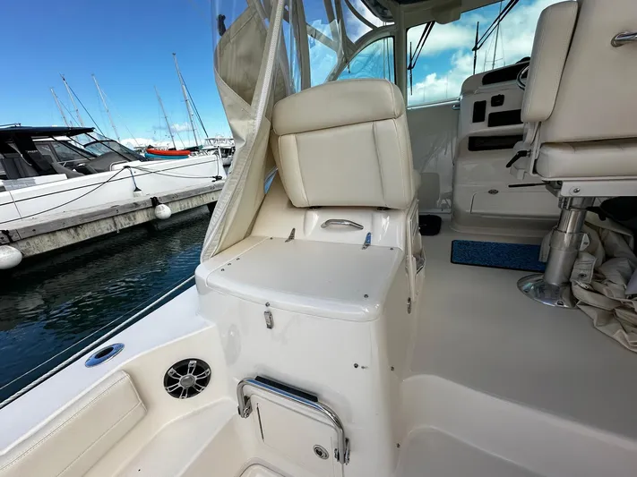  Yacht Photos Pics 2021 Grady-White Express 370 boat interior with white seating and marina view.