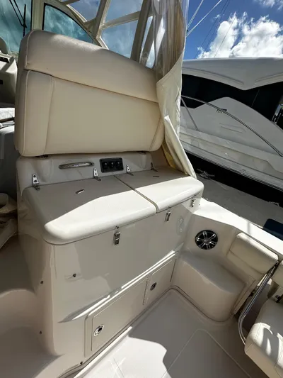  Yacht Photos Pics 2021 Grady-White Express 370 boat interior with cushioned seating and storage compartments.