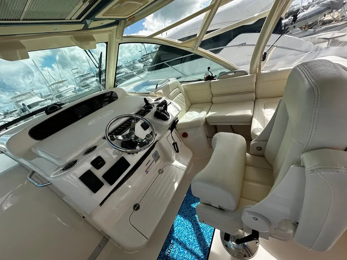  Yacht Photos Pics 2021 Grady-White Express 370 helm with luxurious seating and modern controls.