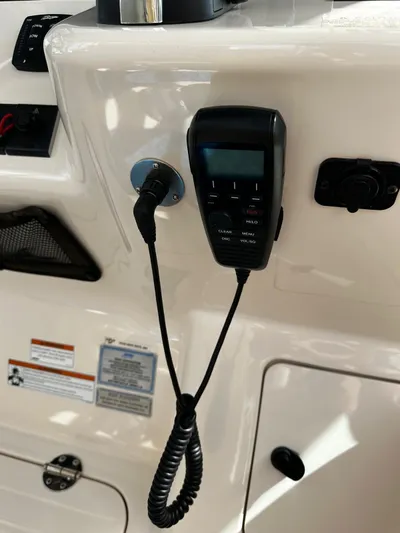  Yacht Photos Pics 2021 Grady-White Express 370 boat dashboard with radio equipment.