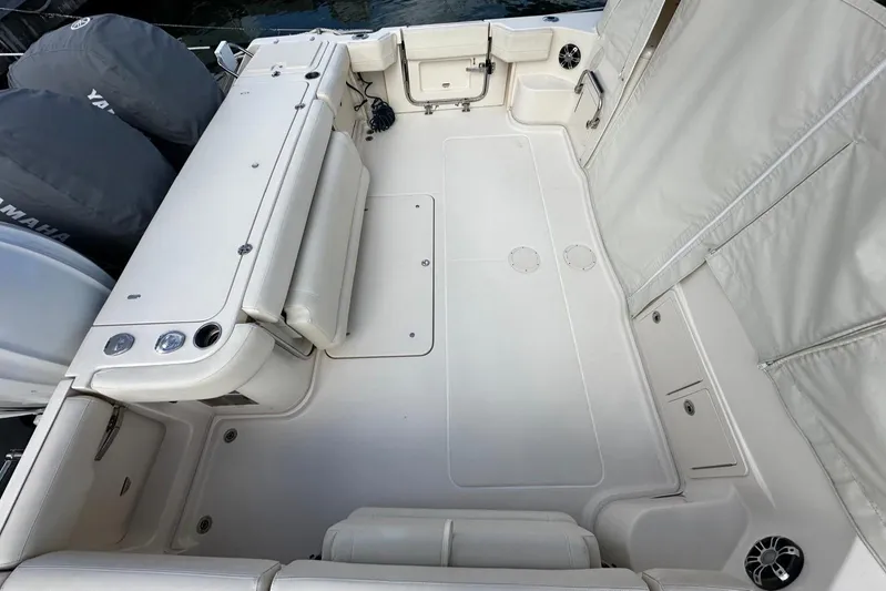  Yacht Photos Pics 2021 Grady-White Express 370 boat deck with Yamaha engines, spacious seating, and storage compartments.