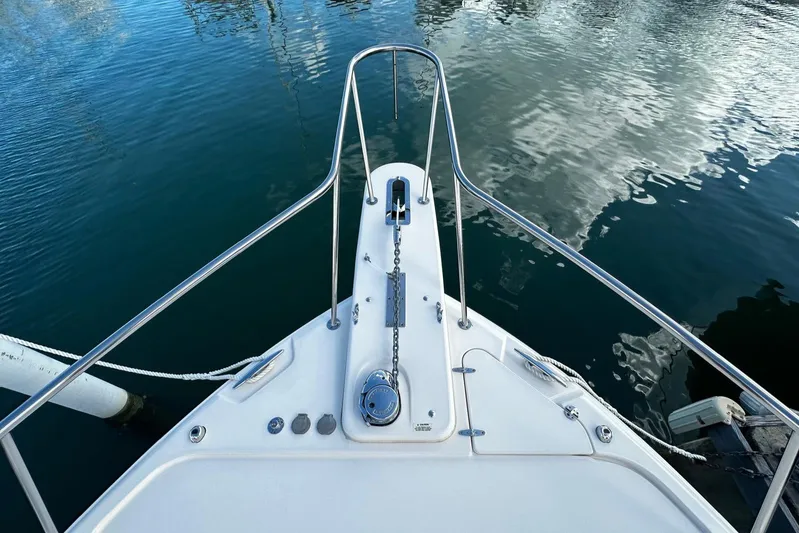  Yacht Photos Pics Bow view of 2021 Grady-White Express 370 boat on calm water.
