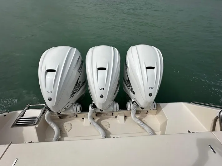  Yacht Photos Pics 2021 Grady-White Express 370 with triple V8 outboard engines on water.