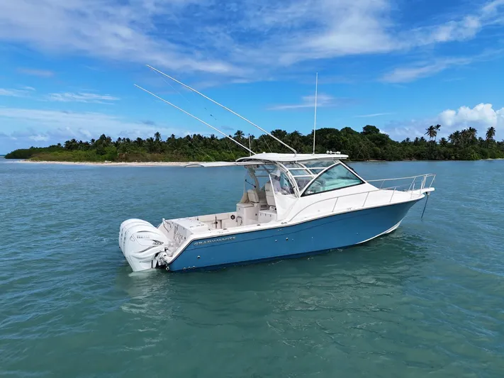  Yacht Photos Pics 2021 Grady-White Express 370 boat on calm tropical waters.
