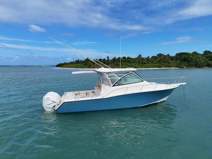  Yacht Photos Pics 2021 Grady-White Express 370 boat on calm tropical waters.