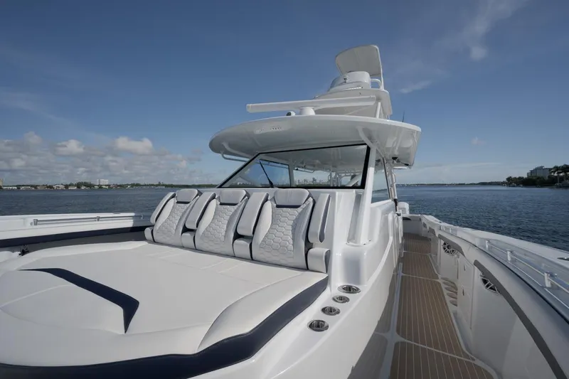  Yacht Photos Pics 2022 Yellowfin 54 Offshore boat with sleek design, spacious seating, and ocean backdrop.