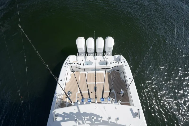  Yacht Photos Pics 2022 Yellowfin 54 Offshore boat with four engines, viewed from above on water.