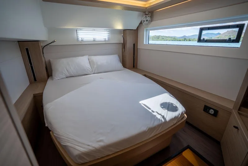 Blossom Yacht Photos Pics Luxurious cabin interior of 2024 Lagoon 46 yacht with scenic window view.