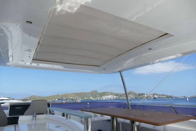  Yacht Photos Pics Flybridge view of 2016 Princess 72 Motor Yacht with scenic ocean backdrop.