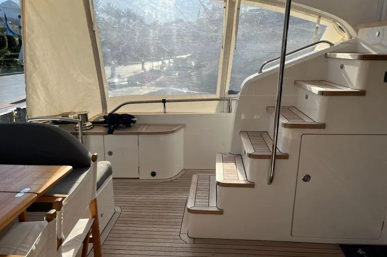  Yacht Photos Pics Interior of 2016 Princess 72 Flybridge Motor Yacht with wooden flooring and stairs.