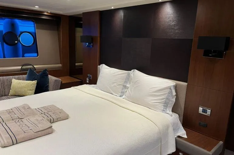  Yacht Photos Pics Luxurious bedroom interior of 2016 Princess 72 Flybridge Motor Yacht with elegant bedding.