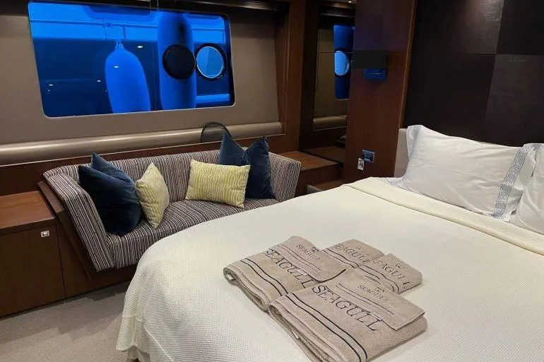  Yacht Photos Pics Luxurious bedroom interior of 2016 Princess 72 Flybridge Motor Yacht with elegant decor.