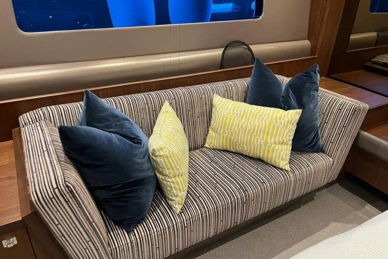  Yacht Photos Pics Luxurious striped sofa with blue and yellow cushions on 2016 Princess 72 Flybridge Yacht.