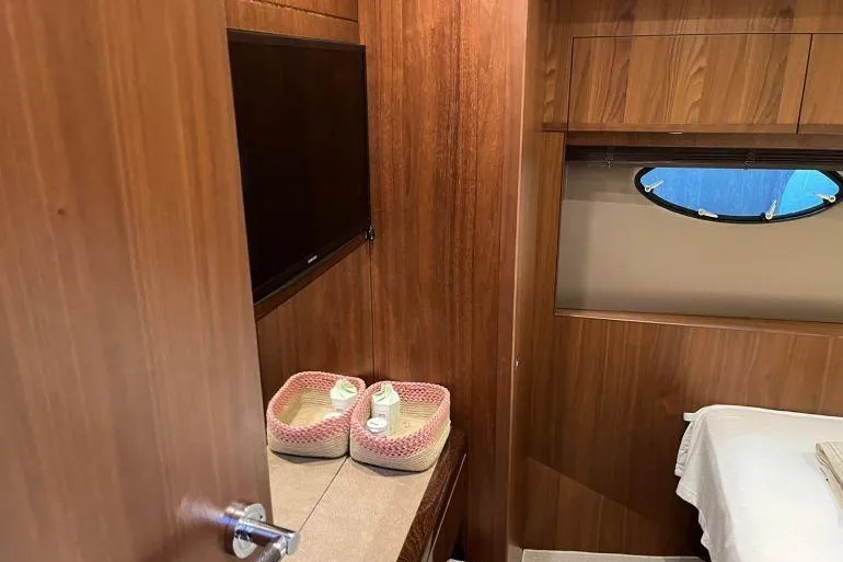  Yacht Photos Pics Luxurious cabin interior of 2016 Princess 72 Flybridge Motor Yacht with wood paneling.