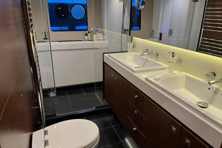  Yacht Photos Pics Luxurious bathroom in 2016 Princess 72 Flybridge Motor Yacht with dual sinks and modern fixtures.