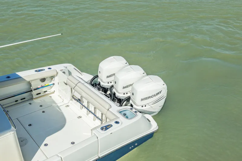  Yacht Photos Pics 2017 Boston Whaler 350 Outrage with triple Mercury outboard engines on calm water.