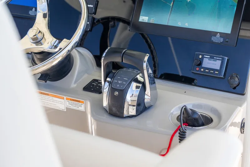  Yacht Photos Pics 2017 Boston Whaler 350 Outrage helm with steering wheel and electronic controls.