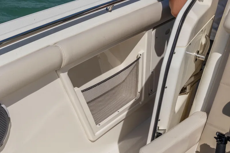  Yacht Photos Pics 2017 Boston Whaler 350 Outrage interior detail with storage net and seating.