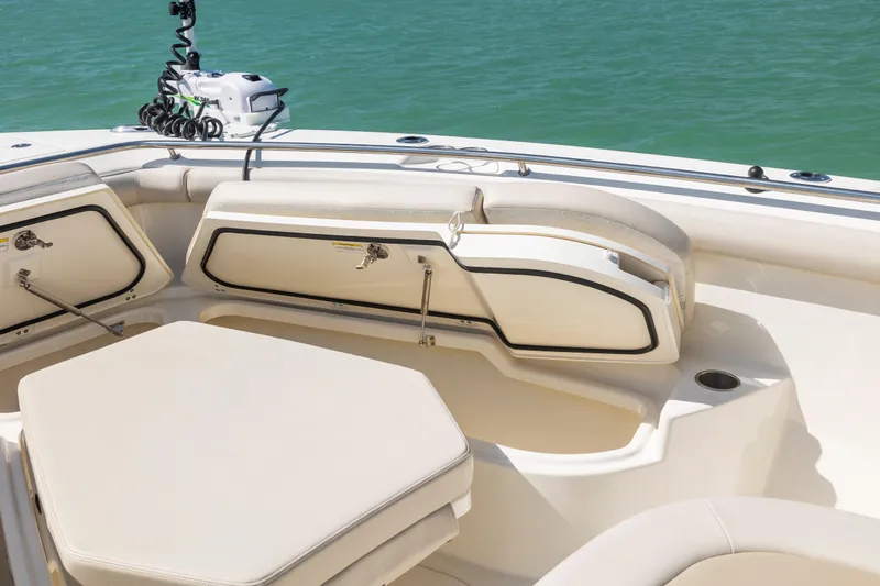  Yacht Photos Pics 2017 Boston Whaler 350 Outrage boat interior with cushioned seating and storage compartments.
