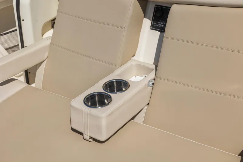  Yacht Photos Pics 2017 Boston Whaler 350 Outrage boat seating with cup holders and beige upholstery.