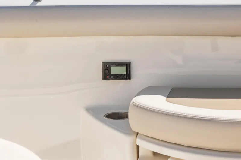  Yacht Photos Pics 2017 Boston Whaler 350 Outrage interior with control panel and cushioned seating.