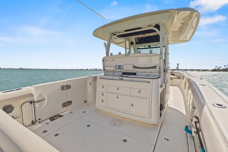  Yacht Photos Pics 2017 Boston Whaler 350 Outrage boat interior with ocean view and clear sky.