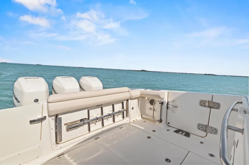 Yacht Photos Pics 2017 Boston Whaler 350 Outrage boat with triple Mercury engines on open water.