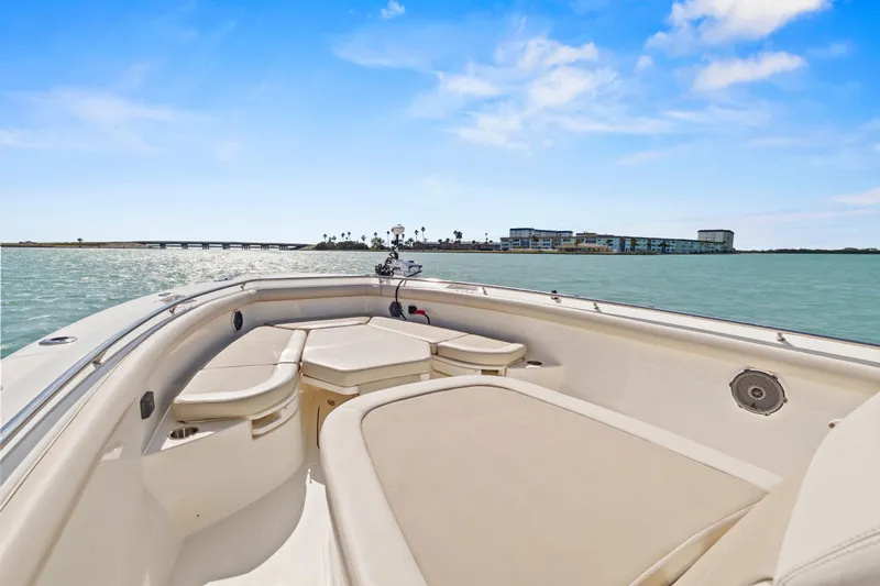  Yacht Photos Pics 2017 Boston Whaler 350 Outrage boat on calm waters under blue sky.