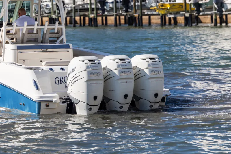  Yacht Photos Pics 2017 Boston Whaler 350 Outrage with triple Mercury engines on the water.