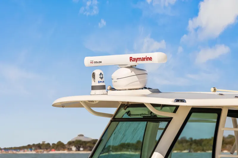  Yacht Photos Pics 2017 Boston Whaler 350 Outrage with Raymarine radar, clear sky background.