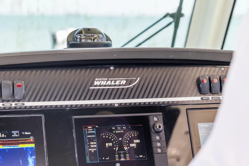  Yacht Photos Pics Dashboard of a 2017 Boston Whaler 350 Outrage boat with navigation instruments.