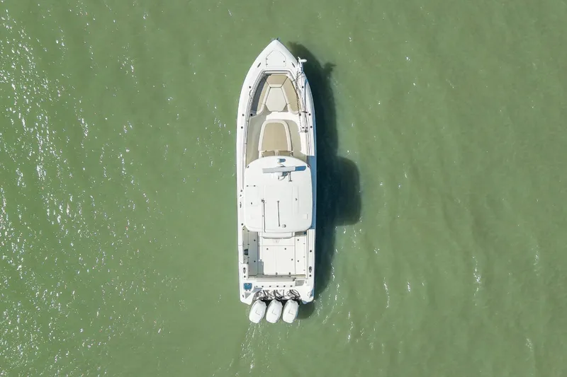 Yacht Photos Pics Aerial view of 2017 Boston Whaler 350 Outrage on green water.