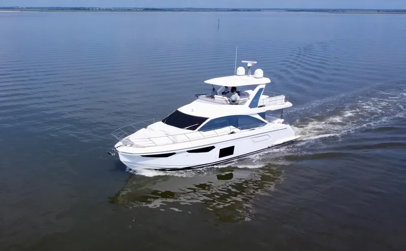  Yacht Photos Pics Azimut Fly 60 yacht cruising on calm waters, 2022 model.