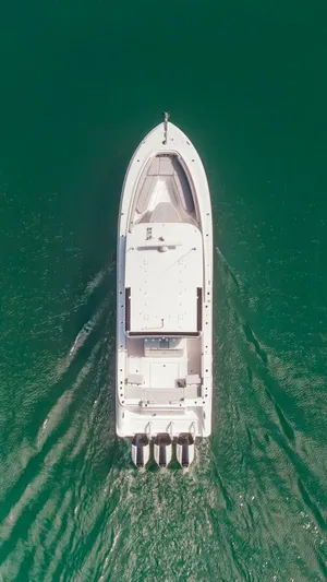  Yacht Photos Pics Aerial view of 2024 HCB 42 Lujo boat cruising on green water.