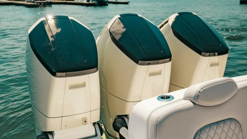  Yacht Photos Pics 2024 HCB 42 Lujo boat with three powerful outboard engines on the water.