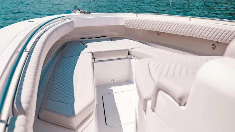  Yacht Photos Pics 2024 HCB 42 Lujo boat interior with luxurious seating and elegant design on calm water.