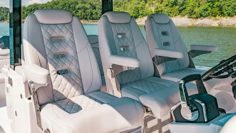  Yacht Photos Pics Luxurious seating on 2024 HCB 42 Lujo boat, featuring quilted leather and armrests.