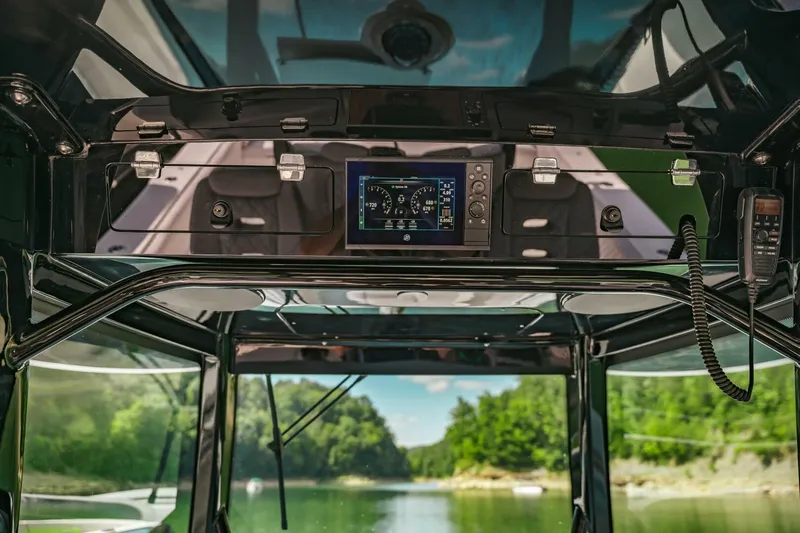  Yacht Photos Pics 2024 HCB 42 Lujo boat interior with advanced navigation system, overlooking serene waterway.