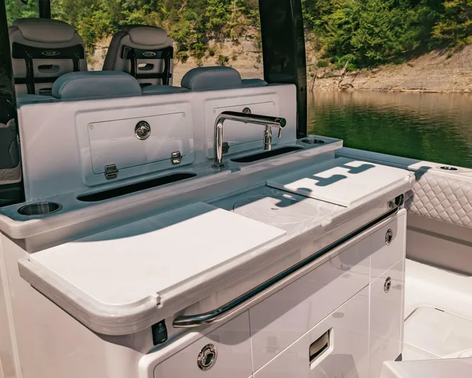  Yacht Photos Pics 2024 HCB 42 Lujo boat interior with sleek kitchen and seating area.