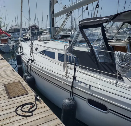 Spotted Drum II Yacht Photos Pics 2004 Catalina 42 Mk II sailboat docked at marina, surrounded by other boats.