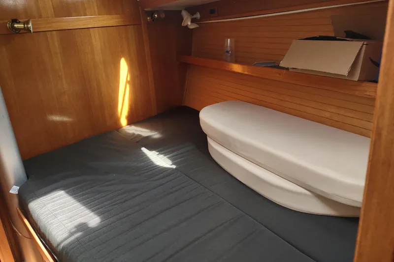Spotted Drum II Yacht Photos Pics Cozy cabin interior of 2004 Catalina 42 Mk II sailboat with wooden finish.