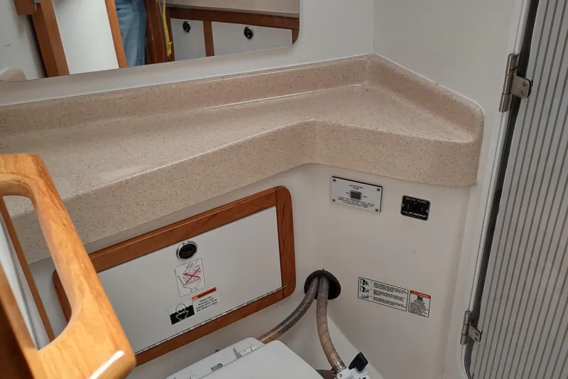 Spotted Drum II Yacht Photos Pics Interior of 2004 Catalina 42 Mk II yacht, featuring a compact bathroom countertop.