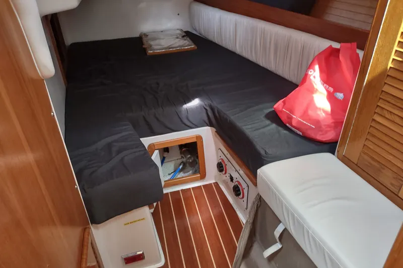 Spotted Drum II Yacht Photos Pics Interior cabin of a 2004 Catalina 42 Mk II sailboat with wooden flooring.