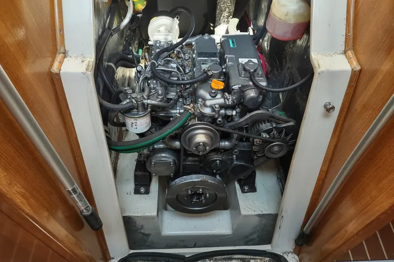 Spotted Drum II Yacht Photos Pics Engine compartment of a 2004 Catalina 42 Mk II sailboat, showcasing detailed mechanical components.
