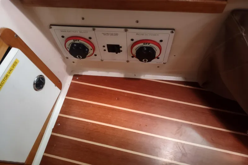 Spotted Drum II Yacht Photos Pics Control panel on 2004 Catalina 42 Mk II sailboat with wooden flooring.