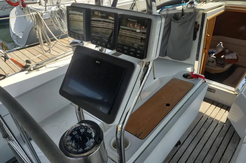 Spotted Drum II Yacht Photos Pics Cockpit of 2004 Catalina 42 Mk II sailboat with navigation instruments and compass.