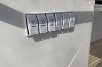 Control panel on 2016 Princess V58 Open yacht with labeled switches.