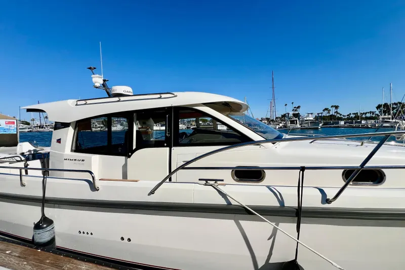 Kala Yacht Photos Pics 2018 Nimbus 365 Coupe yacht docked in a sunny marina.